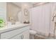 Modern bathroom with white vanity and geometric shower curtain at 13930 W Tierra Grande --, Surprise, AZ 85387