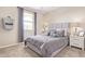 Cozy bedroom with a queen bed, nightstands and window at 13930 W Tierra Grande --, Surprise, AZ 85387