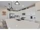 White kitchen with an island, stainless steel appliances, and plenty of cabinet space at 13930 W Tierra Grande --, Surprise, AZ 85387