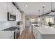 Bright kitchen featuring an island, stainless steel appliances, and wood-look floors at 13930 W Tierra Grande --, Surprise, AZ 85387