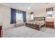 Spacious Primary bedroom with carpeted floors, a ceiling fan, and large windows at 13930 W Tierra Grande --, Surprise, AZ 85387