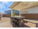 Outdoor kitchen with grill and seating under a pergola at 13930 W Tierra Grande --, Surprise, AZ 85387