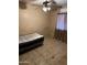 Bedroom with tile floors, ceiling fan, and a bed at 141 E Kesler Ln, Chandler, AZ 85225