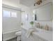 Updated bathroom with white subway tile, bathtub, and floating vanity at 1436 E Downing St, Mesa, AZ 85203