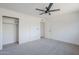 Spacious bedroom with ceiling fan and large closet at 1436 E Downing St, Mesa, AZ 85203