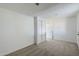 Spacious bedroom with neutral carpet and double door closet at 1436 E Downing St, Mesa, AZ 85203