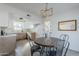 Updated kitchen with light wood cabinets and quartz countertops at 1436 E Downing St, Mesa, AZ 85203