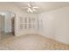 Spacious dining area with tiled floors,plantation shutters, and access to entryway at 14543 W Bison Path, Surprise, AZ 85374
