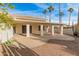 House exterior with a large covered patio and desert landscaping at 14543 W Bison Path, Surprise, AZ 85374