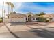 Single-story home with tile roof, two-car garage, and desert landscaping at 14543 W Bison Path, Surprise, AZ 85374