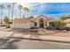 Single-story home with tile roof, two-car garage, and desert landscaping at 14543 W Bison Path, Surprise, AZ 85374