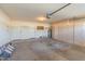 Attached garage with ample storage cabinets and space for two cars at 14543 W Bison Path, Surprise, AZ 85374