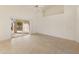 Living room with tile floors and sliding glass doors to patio at 14543 W Bison Path, Surprise, AZ 85374