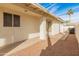 Side yard access with additional covered patio space at 14543 W Bison Path, Surprise, AZ 85374