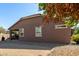 Backyard view, showing gravel, covered patio, and house exterior at 16468 W Mariposa Grande --, Surprise, AZ 85387