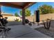 Covered patio with a punching bag and weight bench at 16468 W Mariposa Grande --, Surprise, AZ 85387