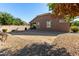Spacious backyard with gravel landscaping and covered patio at 16468 W Mariposa Grande --, Surprise, AZ 85387