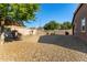 Landscaped backyard with gravel and small trees at 16468 W Mariposa Grande --, Surprise, AZ 85387