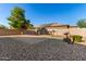 Backyard with gravel, small trees, and a block wall at 16468 W Mariposa Grande --, Surprise, AZ 85387