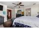Spacious bedroom with a large bed, dresser, and ceiling fan at 16468 W Mariposa Grande --, Surprise, AZ 85387