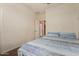 Bright bedroom with double bed and access to another room at 16468 W Mariposa Grande --, Surprise, AZ 85387