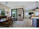 Dining room with wooden table and chairs, view to the patio at 17221 W Middlebury St, Surprise, AZ 85388