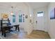 Light and airy entryway with wood floors and an open concept at 17221 W Middlebury St, Surprise, AZ 85388