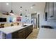 Modern kitchen with a large island, stainless steel appliances, and ample counter space at 17221 W Middlebury St, Surprise, AZ 85388