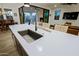Modern kitchen island sink with a unique faucet fixture at 17221 W Middlebury St, Surprise, AZ 85388