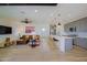 Open floor plan with living room, kitchen, and breakfast bar at 17221 W Middlebury St, Surprise, AZ 85388