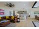 Spacious living room with leather sectional sofa and large TV at 17221 W Middlebury St, Surprise, AZ 85388