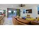Open living space with leather sofa and sliding glass doors to the backyard at 17221 W Middlebury St, Surprise, AZ 85388