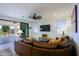 Living room with sectional sofa and view of backyard patio at 17221 W Middlebury St, Surprise, AZ 85388