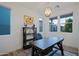 Bright and airy home office with built-in shelving and large windows at 17221 W Middlebury St, Surprise, AZ 85388