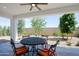Covered patio with seating area and view of landscaped backyard at 17221 W Middlebury St, Surprise, AZ 85388