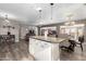 Open kitchen with island and view into dining and living areas at 2001 W Surrey Ave, Phoenix, AZ 85029