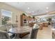 Breakfast nook with table and chairs, open to the kitchen at 20064 N Rawhide Way, Surprise, AZ 85387