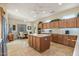 Spacious kitchen with island, stainless steel appliances, and ample cabinetry at 20064 N Rawhide Way, Surprise, AZ 85387