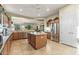 Bright kitchen with island, stainless steel appliances, and wood cabinetry at 20064 N Rawhide Way, Surprise, AZ 85387