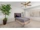 Cozy bedroom with window, ceiling fan, and neutral wall tones at 21630 N Yellowstone Cir, Sun City West, AZ 85375