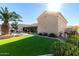 Landscaped backyard with artificial turf and pool at 21774 E Camacho Rd, Queen Creek, AZ 85142