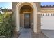 Front entry with arched doorway and security door at 25781 W Nancy Ln, Buckeye, AZ 85326