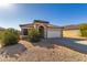 One-story home with tile roof, arched entryway, and attached garage at 25781 W Nancy Ln, Buckeye, AZ 85326