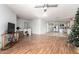 Open concept living room with kitchen view and laminate flooring at 25781 W Nancy Ln, Buckeye, AZ 85326