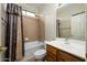 Bathroom with shower/tub combo and wood vanity at 2737 N 160Th Ave, Goodyear, AZ 85395