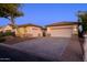 Two-car garage, light-colored stucco, and landscaping at 2737 N 160Th Ave, Goodyear, AZ 85395