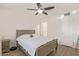 Well-lit bedroom with a double bed and ceiling fan at 3002 W Griswold Rd, Phoenix, AZ 85051