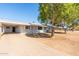 View of the home's front and driveway at 3002 W Griswold Rd, Phoenix, AZ 85051