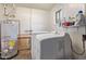 Laundry room with washer, dryer, and utility sink at 3002 W Griswold Rd, Phoenix, AZ 85051