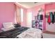 Another view of the pink bedroom with a bed and storage at 4124 W Gary Way, Laveen, AZ 85339